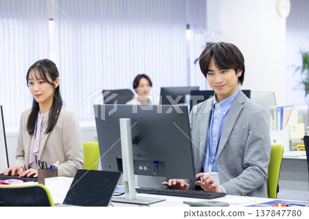 Men and women working in business offices Men and women working in business offices 137847780