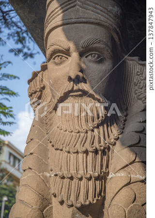 Ancient Lamassu Statue Detail at Parsi Fire Temple in Mumbai with copy space Ancient Lamassu Statue Detail at Parsi Fire Temple in Mumbai with copy space 137847943