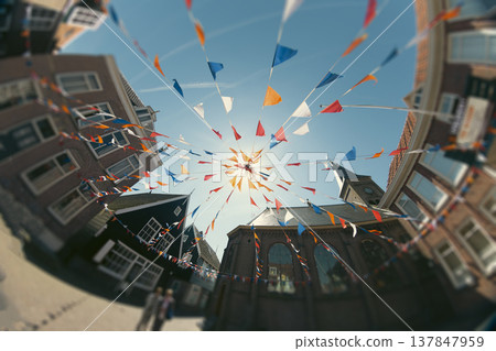 Festive Bunting Flags and Fisheye View of Marken Square Netherlands with Copy Space Festive Bunting Flags and Fisheye View of Marken Square Netherlands with Copy Space 137847959