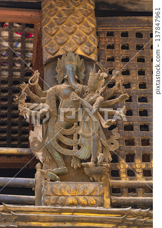 Lord Ganesha and Wife Wood Carving in Nepalese Temple with Copy Space Lord Ganesha and Wife Wood Carving in Nepalese Temple with Copy Space 137847961