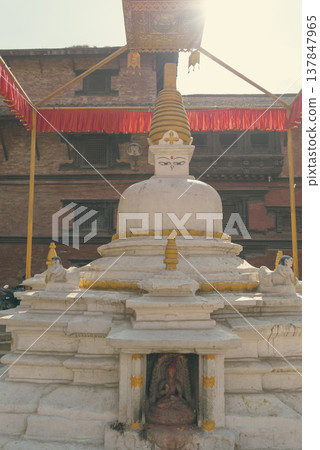 White Buddhist Stupa in Patan Durbar Square Nepal with Sun Flare and Copy Space 137847965