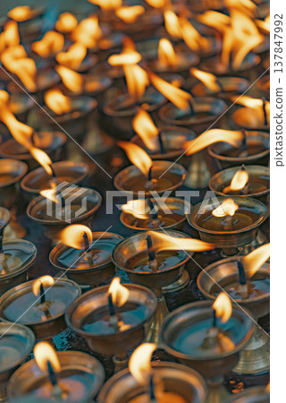 Traditional Burning Oil Butter Lamps in Nepal Temple with Copy Space Traditional Burning Oil Butter Lamps in Nepal Temple with Copy Space 137847992