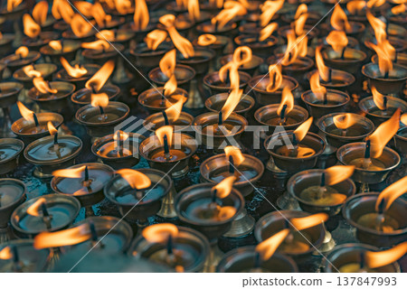 Traditional Burning Oil Butter Lamps in Nepal Temple with Copy Space 137847993