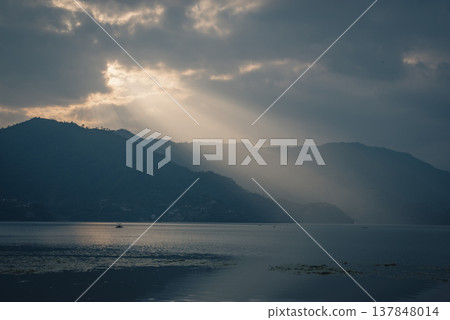 Sun Rays Over Phewa Lake and Mountains in Pokhara Nepal with Copy Space 137848014