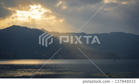 Sunbeams Over Misty Mountains and Phewa Lake in Pokhara Nepal with copy space Sunbeams Over Misty Mountains and Phewa Lake in Pokhara Nepal with copy space 137848015