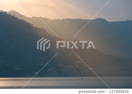 Sunbeams Over Misty Mountains and Phewa Lake in Pokhara Nepal with copy space Sunbeams Over Misty Mountains and Phewa Lake in Pokhara Nepal with copy space 137848016