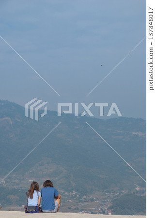Young Couple Looking at Mountains in Kathmandu Valley Nepal with Copy Space Young Couple Looking at Mountains in Kathmandu Valley Nepal with Copy Space 137848017
