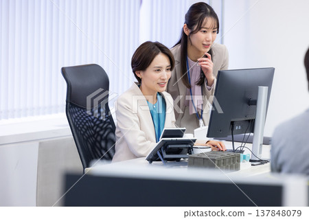 Men and women working in business offices Men and women working in business offices 137848079