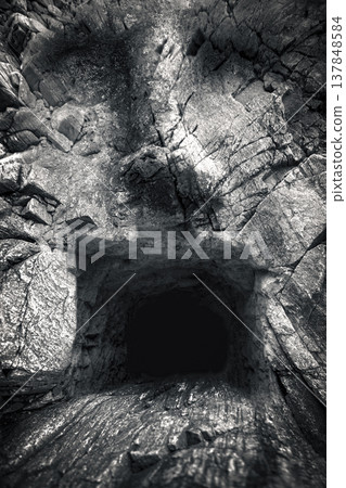 Optical Illusion Stone Giant Face Shaped Cave Entrance Background with Copy Space 137848584