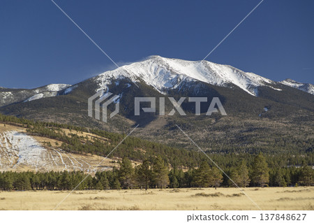 Majestic Snow Capped Humphreys Peak in Flagstaff Arizona with Pine Forest and Copy Space Majestic Snow Capped Humphreys Peak in Flagstaff Arizona with Pine Forest and Copy Space 137848627
