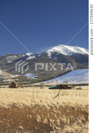 Scenic Ranch House at Foot of Snow Capped Humphreys Peak Arizona with Copy Space Scenic Ranch House at Foot of Snow Capped Humphreys Peak Arizona with Copy Space 137848630