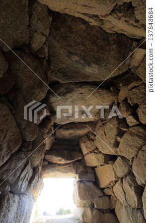 The stonework of the burial chamber from the entrance passage to the burial mound, located within the grounds of Enmei-in Temple. The stonework of the burial chamber from the entrance passage to the burial mound, located within the grounds of Enmei-in Temple. 137848684
