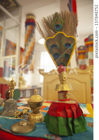 Tibetan Buddhist Ritual Vessel Bumpa with Peacock Feathers and Bell on Altar with Copy Space Tibetan Buddhist Ritual Vessel Bumpa with Peacock Feathers and Bell on Altar with Copy Space 137848752