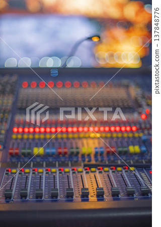 Professional Digital Soundboard Mixing Console with Glowing Lights and Copy Space for Event Concept Professional Digital Soundboard Mixing Console with Glowing Lights and Copy Space for Event Concept 137848776