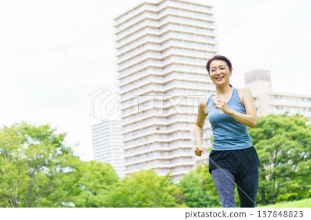 Middle woman jogging Middle woman jogging 137848823