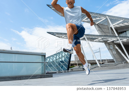 middle-aged man jumping middle-aged man jumping 137848953