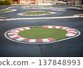 Wide angle view of outdoor RC car race track with asphalt and curves 137848993