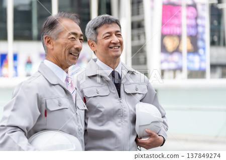 A middle-aged male worker working at the site A middle-aged male worker working at the site 137849274