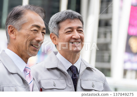 A middle-aged male worker working at the site A middle-aged male worker working at the site 137849275