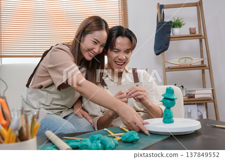 A young Asian couple spend time together at home A young Asian couple spend time together at home 137849552