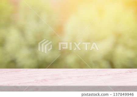 Marble Toptable with Blurred Green Garden and Light Leak Background. Marble Toptable with Blurred Green Garden and Light Leak Background. 137849946
