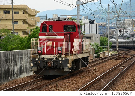 Hybrid locomotive HD300 passing through Sakura-Shukugawa Station (deadheading) Hybrid locomotive HD300 passing through Sakura-Shukugawa Station (deadheading) 137850567