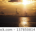 A port illuminated by the sunset 137850814