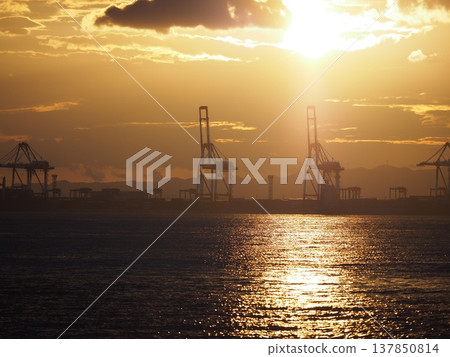 A port illuminated by the sunset 137850814