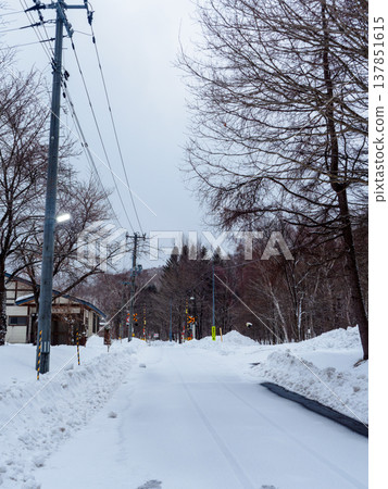 Snow-covered road Snow-covered road 137851615