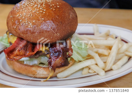 A delicious hamburger to eat at a popular restaurant while traveling A delicious hamburger to eat at a popular restaurant while traveling 137851840