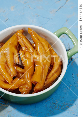 asian boneless chicken feet in a casserole 137852110