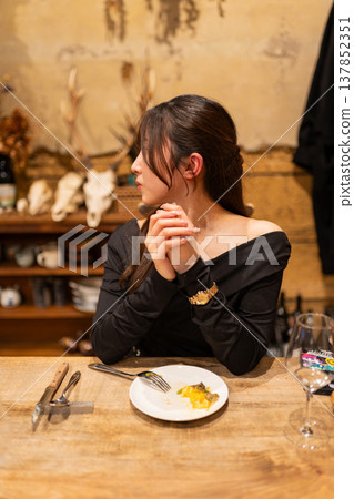 Woman relaxing at the bar 137852351