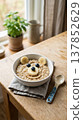 Cute bear face oatmeal with banana and blueberries for a fun breakfast 137852629