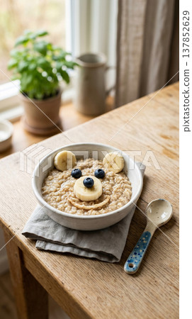 Cute bear face oatmeal with banana and blueberries for a fun breakfast 137852629