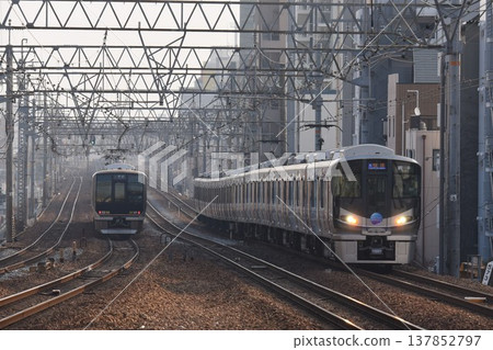 A southbound train passing through Sakura-Shukugawa Station on the quadruple-track Tokaido Main Line. A southbound train passing through Sakura-Shukugawa Station on the quadruple-track Tokaido Main Line. 137852797