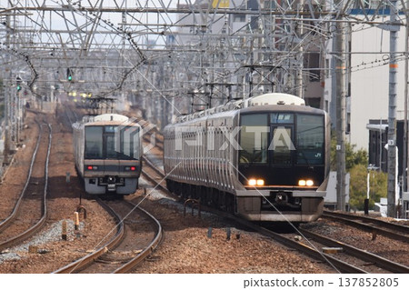 A southbound train passing through Sakura-Shukugawa Station on the quadruple-track Tokaido Main Line. A southbound train passing through Sakura-Shukugawa Station on the quadruple-track Tokaido Main Line. 137852805