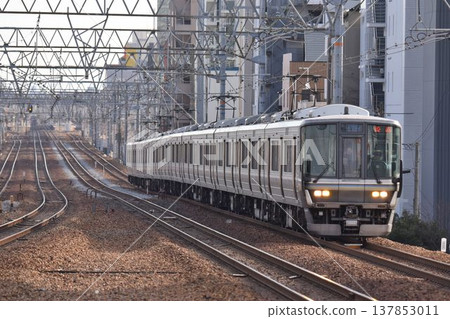 A southbound train passing through Sakura-Shukugawa Station on the quadruple-track Tokaido Main Line. A southbound train passing through Sakura-Shukugawa Station on the quadruple-track Tokaido Main Line. 137853011