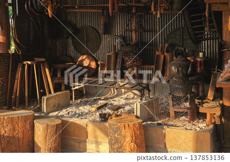 A rustic workshop filled with tools and equipment, exuding craftsmanship and history of Aka tribal in Northern Thailand 137853136