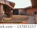 Rustic charm of a wooden buildings with a pathway leading to a doorway, showcasing the building structure 137853157