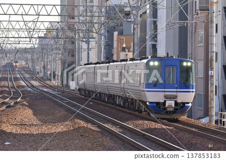 The Super Hakuto express train passes Sakura-Shukugawa Station on the quadruple-track Tokaido Main Line The Super Hakuto express train passes Sakura-Shukugawa Station on the quadruple-track Tokaido Main Line 137853183
