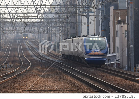 The Super Hakuto express train passes Sakura-Shukugawa Station on the quadruple-track Tokaido Main Line The Super Hakuto express train passes Sakura-Shukugawa Station on the quadruple-track Tokaido Main Line 137853185