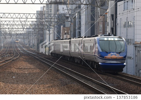 The Super Hakuto express train passes Sakura-Shukugawa Station on the quadruple-track Tokaido Main Line The Super Hakuto express train passes Sakura-Shukugawa Station on the quadruple-track Tokaido Main Line 137853186
