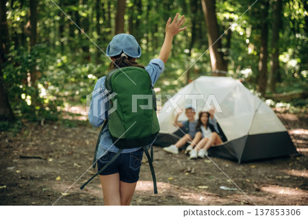 By the tent. Girls kids are in the forest, hike conception By the tent. Girls kids are in the forest, hike conception 137853306