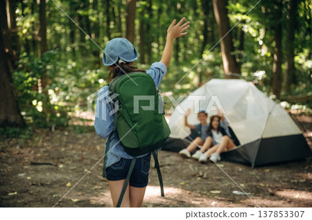 By the tent. Girls kids are in the forest, hike conception By the tent. Girls kids are in the forest, hike conception 137853307