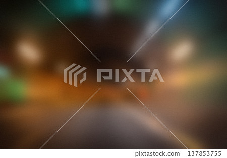 Blurred view of a tunnel interior with illuminated lights and colorful reflections creating an abstract visual effect in a dark environment Blurred view of a tunnel interior with illuminated lights and colorful reflections creating an abstract visual effect in a dark environment 137853755
