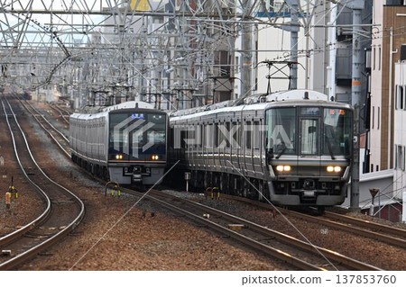 A southbound train passing through Sakura-Shukugawa Station on the quadruple-track Tokaido Main Line. A southbound train passing through Sakura-Shukugawa Station on the quadruple-track Tokaido Main Line. 137853760