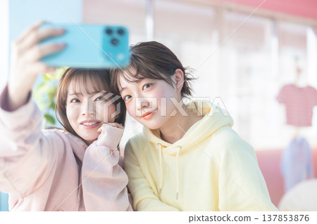 Woman taking a selfie Woman taking a selfie 137853876
