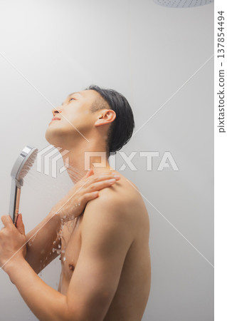 Men taking a shower Men taking a shower 137854494