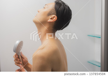 Men taking a shower Men taking a shower 137854504