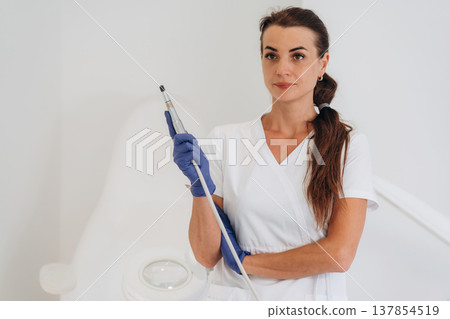 Podiatrist is in the clinic with equipment Podiatrist is in the clinic with equipment 137854519